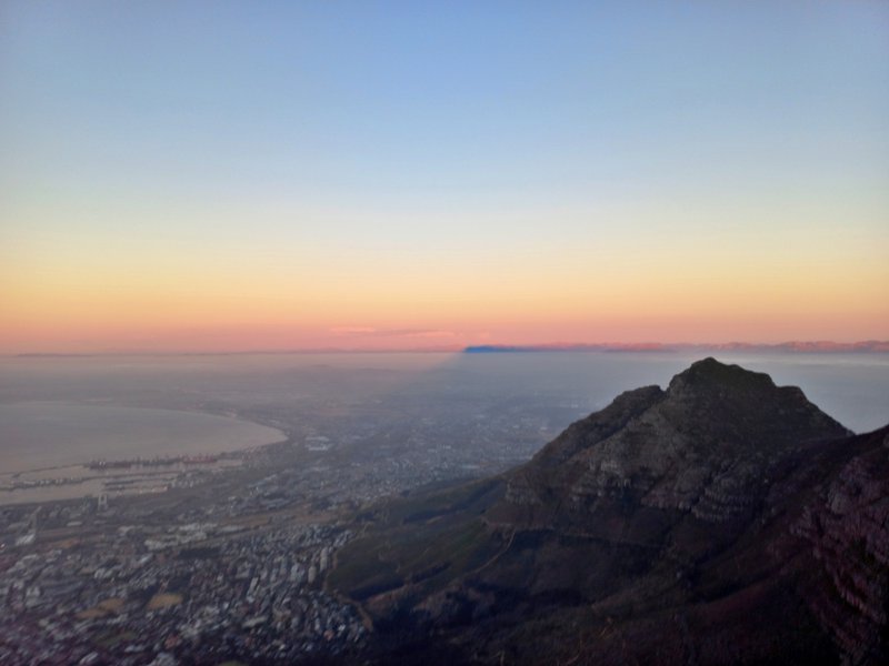 sunset silhouette of Table Mountain from upper cable station, view of City, Devil's Peak etc Jan 24