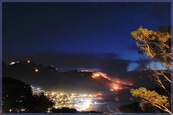 Nigh shot of Table Mountain's Twelve Apostles on fire October 2017