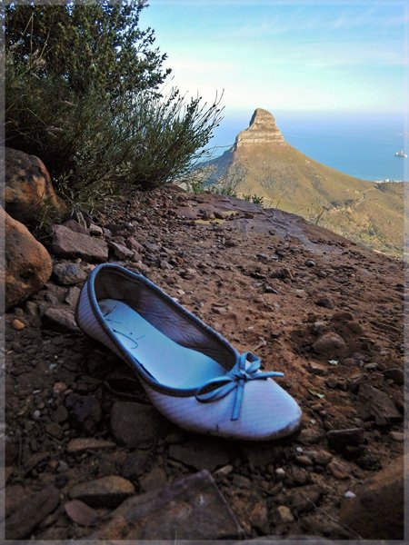 Woman's Pump shoe found on Table Mountain trail with Lion's Head in background