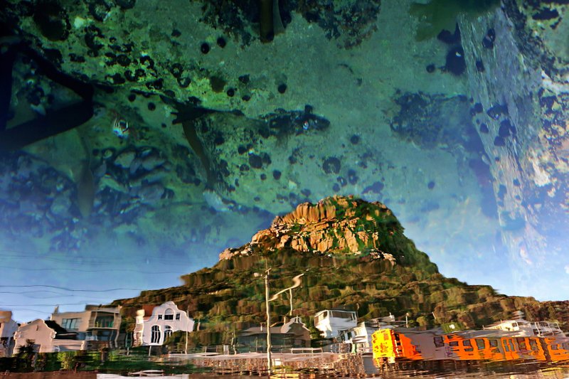 False Bay train reflected in tital pool